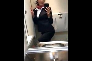naughty busty stewardess playing with her pussy in restroom